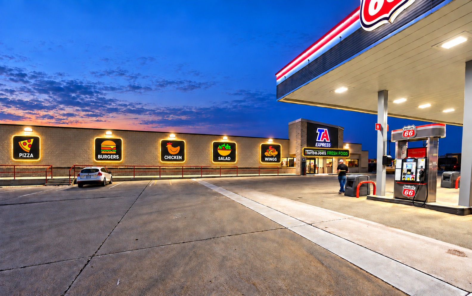 TA Express storefront and fuel canopy at dusk with illuminated Turbo Joe’s signage